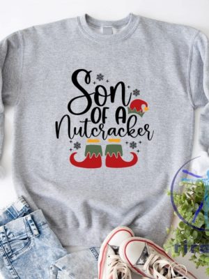 Funny Christmas Son Of A Nutcracker Shirt Hoodie Sweatshirt Gift Holiday Spirit Shirt Cute Christmas Elf Tee Party Outfit Gift For Her Gift For Him riracha 8